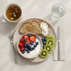 Delicious and Healthy Breakfast Yogurt with Berries, Toast, Tea, and Refreshing Water