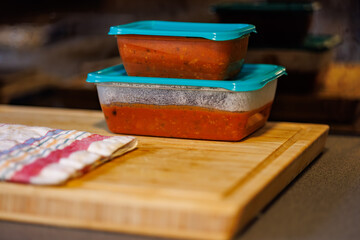 Freshly prepared tomato sauce stored in containers ready for meal prep and cooking