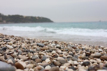Beautiful sea and pebbles on beach, selective focus