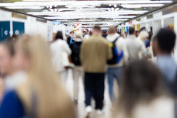 Abstract blurred people at exhibition hall of expo event trade show. Business convention show or...