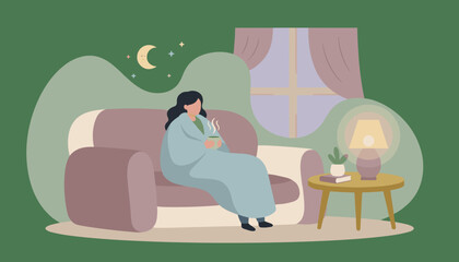 Woman enjoying a hot drink on a sofa under a blanket at night Cozy home relaxation