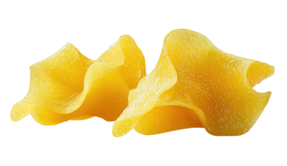 Two curled, textured, yellow pasta pieces on a black background