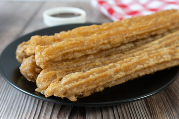 Close-up of freshly made churros on a table, Mexican food