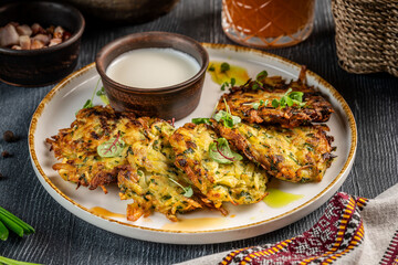 Crispy potato pancakes with sour cream sauce
