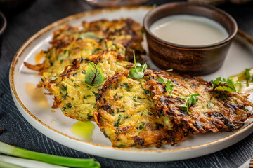 Golden potato pancakes with sour cream dip