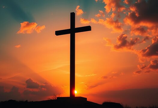Silhouetted cross at sunset, fiery sky reflecting faith,  forgiveness,  biblical