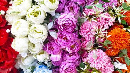 roses,designer composition of artificial flowers, floral background in retro style