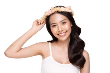 Asian Smiling young woman wearing floral crown and white tank top, holding crown with one hand, natural makeup, long dark hair, joyful summer portrait