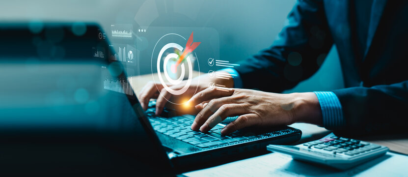 Business target achievement and goal setting strategy with digital checklist and data analytics, businessman working on laptop with financial report and planning concept for success in organization