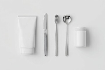 A studio shot of various white and metallic hygiene items