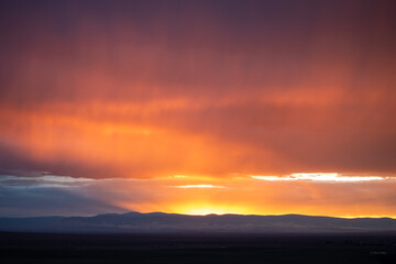 Fototapeta premium Windy red sunset dramatic clouds in Wyoming 