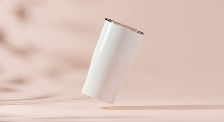 Modern white tumbler floating against a soft neutral background with shadows