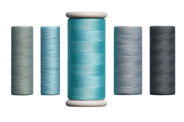 Varied-tone spools of thread, centered around a bright teal hue