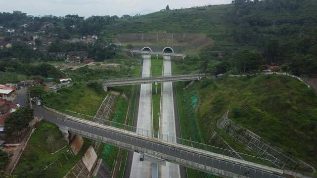 Aerial landscape footage of the Sumedang twin tunnels on Cisumdawu toll road