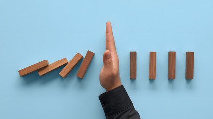 Stopping the domino effect for business risk, crisis management and problem solving success concept