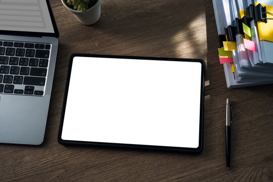 Digital tablet mockup with blank white screen iPad digital tablet office desk, Copy space for app UI, website, presentation, business workflow.