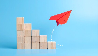 Wooden blocks form steps, red paper airplane flies upwards