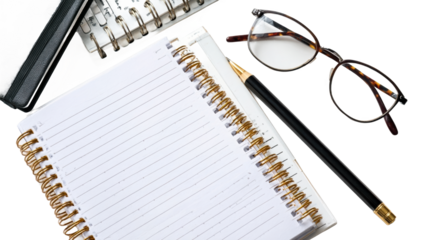 Business workspace with notepad and glasses.