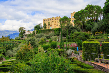Gardens of Trauttmansdorff Castle with mountain panorama near Merano, South Tyrol, Italy