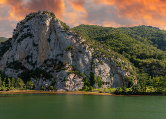 A rocky cliff with ancient Asarkale rock tombs in Bafra, Samsun, Türkiye. Ancient columns carved into the rock. Tourist attractions,