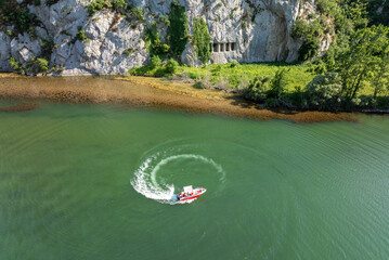 A rocky cliff with ancient Asarkale rock tombs in Bafra, Samsun, Türkiye. Ancient columns carved into the rock. Tourist attractions,