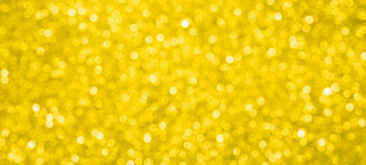 Abstract gold glitter sparkle texture with bokeh background