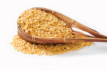 Split soybeans in bamboo basket on white background. Healthy food concept.