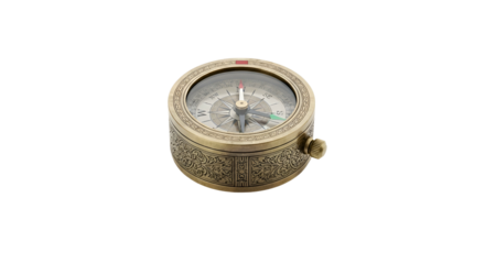 Ornate brass compass with a glass face on a black background