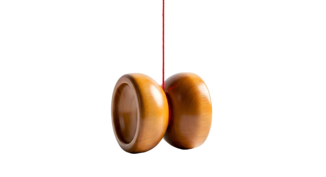 Brown wooden yo-yo suspended in mid-air against a black background