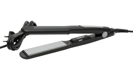 Black flat iron with gray plates and power cord on dark surface