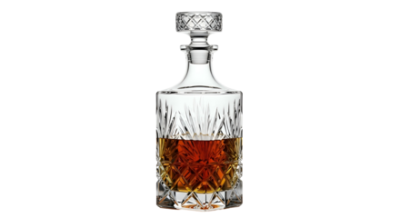 Cut-glass decanter with amber liquid inside, on a dark background