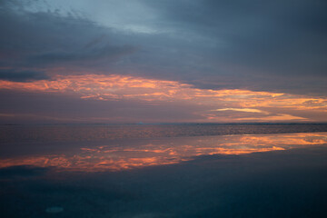 sunset over the sea sunrise clouds reflection pool