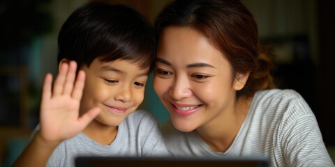 Mother and child looking at a laptop