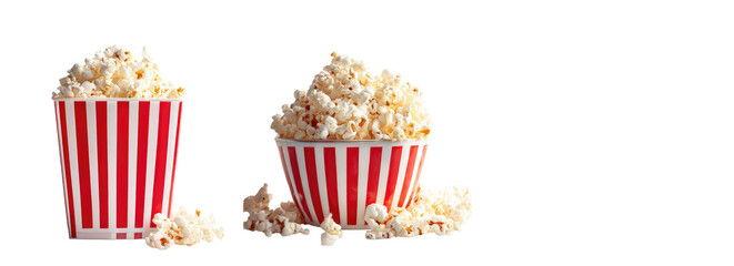 Two red and white striped popcorn bowls filled with fluffy popcorn