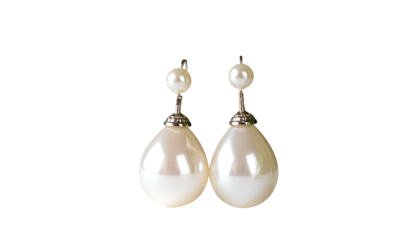 Pearl drop earrings with smaller top bead on black background
