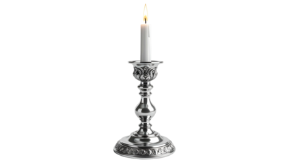 Lit white candle atop an ornate silver candlestick