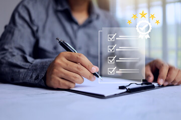 businessman working on paper document to approved certification with check mark on the documents mean that it has been certified to quality standard or has passed