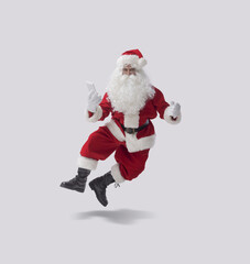 Cheerful Santa Claus checking his smartphone