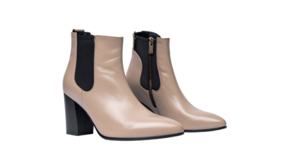 Beige leather heeled ankle boots with black elastic on black background