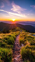 Trail on a mountain ridge at sunset, vibrant colors in the sky