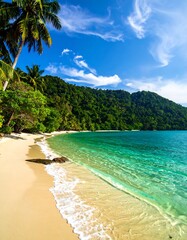 Tropical beach scene with clear turquoise water and lush green mountains
