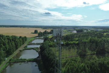 Fototapeta premium Telecommunication mast in green fields