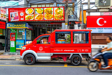 Fototapeta premium Red public transportation tuk tuk car taxi in Phuket Thailand.