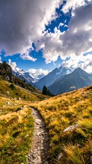 Winding path ascends a mountain, leading to snowy peaks and cloudy skies