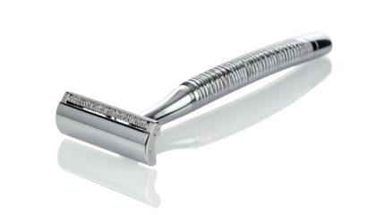 Shiny chrome razor resting on a reflective black surface