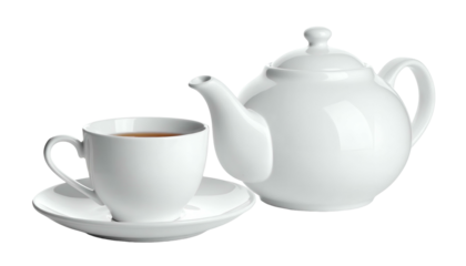 White porcelain teapot and teacup, set against black backdrop