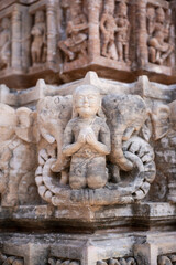 Close-Up of Hindu Deity Holding Sacred Object with Elephant Carving at Shamlaji Temple, Modasa, Gujarat, India