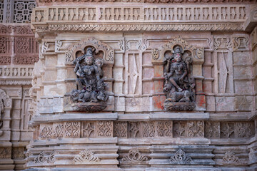 Fototapeta premium Twin Black Goddess Stone Sculptures on Shamlaji Temple Wall, Modasa, Gujarat, India
