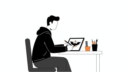 Focused graphic designer crafting a bat logo on a digital tablet Art and design