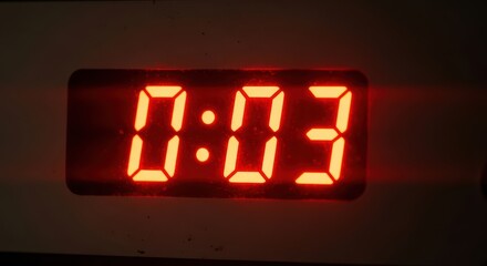 Red digital timer display showing three seconds remaining in countdown